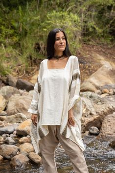 Introducing the TAIKI Light Poncho Top, a one-of-a-kind garment that seamlessly blends the best of ponchos and kaftans for a unique, versatile style statement. Crafted from 100% natural cotton that rests beautifully on your exposed collar bones, the TAIKI Light Poncho Top features a free-flowing, butterfly-style cut that drapes elegantly around the body, creating a flattering silhouette that works for any occasion. The semi-see-through netted fabric in some sections adds an alluring touch of tex Poncho Top, Butterfly Style, Collar Bone, Poncho Tops, Bohemian Hippie, Free Flowing, New Years Sales, Natural Dye, Naturally Dyed