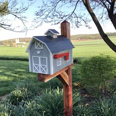 a mailbox in the shape of a barn