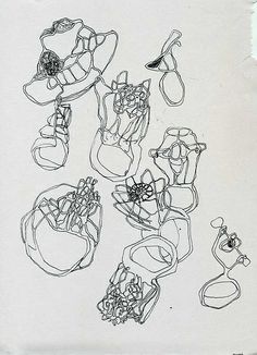 an image of a drawing of shoes and hats on paper with pencils in it