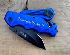 two blue knives with the words i love you the most on them