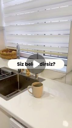 a kitchen sink with the words siz bel disiz? written on it