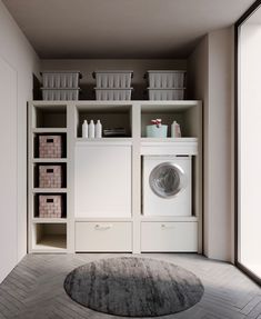 a washer and dryer in a room with white shelves on either side of the door