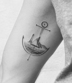 a black and white photo of a ship on the arm with an anchor in it