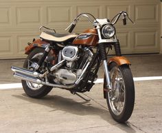 a motorcycle parked in front of a garage door