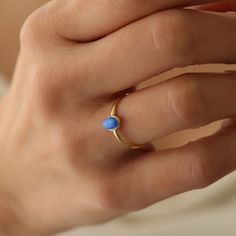 14k Opal Ring,Dainty Ring, Blue Opal Ring,Minimalist Ring, Real Opal ring ❤️Minimalist look and dainty design❤️ ABOUT PRODUCTS; Handmade with 14k Gold,925 Solid Sterling Silver We have color options. Silver Gold Rose gold Comes with a stylish gift-ready elegant jewelry box ** ANY PROBLEMS AND PLEASE CONTACT ME IN ORDER CONTENT, THANK YOU ** Minimalist 14k Gold Opal Promise Ring, Dainty Blue 14k Gold Rings, Minimalist Blue Round Band Ring, Minimalist Blue Stackable Rings In 14k Gold, Minimalist Blue 14k Gold Stackable Rings, Minimalist Opal Promise Ring With Round Band, Adjustable Blue 14k Gold Rings, Delicate Blue Birthstone Ring, Minimalist 14k Gold Opal Ring