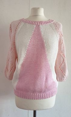 "Great condition hand knit No labelling but yarn feels like cotton orva cotton mix Pink neckline and hem rib with a triangular pink shape on the front and back Pale pink design knit on half sleeves Raglan sleeved  Actual measurements in inches  Neck circ 25\" Chest 40\" Hem 30\" Length from side neck point to hem 22.5\" Raglan seam length on front 11\" Cuff opening 6\" Sleeve length side neck point to cuff end 18\" To see more vintage follow www.etsy.com/shop/skinnyrib" Pink Cotton Pointelle Knit Sweater, Pink Stretch Textured Knit Sweater, Pink Pointelle Knit Crew Neck Sweater, Fitted Textured Knit Pink Sweater, Pink Cotton Knitted Sweater, Pink Knitted Cotton Sweater, Pink Cotton Short-sleeved Sweater, Pink Short Sleeve Cotton Sweater, Pink Knitted Cotton Top