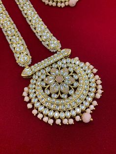 Add a touch of class to your wardrobe with the samantha Kundan Mala Set. Crafted with an exquisite meena kundan design and detailed with glass beads, green meena lining and a matching earring and tikka, this elegant set is perfect for accessorizing any special occasion look. Kundan Mala Set, Festive Pink Jewelry With Dori Work, Traditional Pink Jewelry With Dori Work, Bollywood Kundan Jewelry With Dori Work, Pink Kundan Necklace With Intricate Design, Gold Kundan Necklace With Dori Work, Pink Dori Work Jewelry For Wedding, Pink Wedding Jewelry With Dori Work, Kundan Design