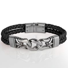 This stylish men's bracelet features a braided genuine black leather strap with a premium grade 316L solid stainless steel finish. Fits up to an 8" wrist, magnificent presentation case included. Modern Leather Bracelet With Stainless Steel Clasp For Business, Elegant Black Metal Braided Bracelets, Black Stainless Steel Business Jewelry, Masculine Black Leather Bracelet With Stainless Steel, Black Leather Bracelet With Stainless Steel Clasp For Business, Classic Black Stainless Steel Chain Bracelet, Adjustable Gunmetal Bracelet For Formal Occasions, Classic Adjustable Black Chain Bracelet, Classic Black Leather Bracelet For Business