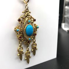 "Vintage Celebrity Persian Pendant Necklace, Faux Turquoise Cabochon and Red Crystal, Ottoman Pendant with Gold Tone Dangles on Golden Snake Chain Measurement * 34\" with 3\" x 1-1/4\" pendant Condition * Excellent condition. Gently worn." Antique Red Dangle Jewelry, Victorian Turquoise Pendant Jewelry, Bohemian Style Cabochon Dangle Jewelry, Ornate Jeweled Dangle Jewelry, Golden Snake, Golden Rose, Yellow Gold Engagement Rings, Station Necklace, Red Crystals