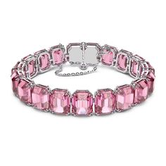 NWB Swarovski Millenia Bracelet, Octagon Cut, Pink, Rhodium Plated- 5610363 Description This pink, crystal bracelet is perfectly crafted with uniform, octagon-cut crystals on a sleek, rhodium-plated prong setting and finished with a fine-jewelry-inspired fastening. An elegant wardrobe essential, this piece can be worn on its own for an ultramodern daytime look, or teamed with the complementary necklace from the Millenia family for chic evening adornment. This bracelet is part of the Millenia family, designed by Creative Director Giovanna Engelbert for Collection III. How to close and open it: slide the hooks into the corresponding holes at the base of the end stone and push to click into place. Fasten the security chain using the small lever clasp. To open, unfasten the security chain and