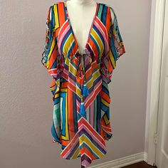 Colorful Low-Neck Swimsuit Cover-Up With Beautiful, Gathered Bodice That Ties With Beaded Tassels. Also Has Beautiful Detailed, Open Sleeves. Multicolor V-neck Cover-up For Beach Party, Casual Multicolor V-neck Cover-up, Spring Multicolor Swimwear For Beach Cover-up, Orange V-neck Swimwear For Spring, Orange V-neck Swimwear For Vacation, Multicolor V-neck Party Swimwear, Striped V-neck Swimwear For Vacation, Casual V-neck Cover-up For Party, Casual V-neck Party Cover-up