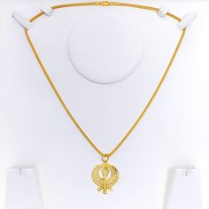 Illuminate your look with this dazzling Khanda Pendant. Weighing 3.9 grams, this pendant boasts a 22k yellow gold finish with intricate design details that are sure to catch the eye. Pendant length is 1.5". Chain not included. Perfect for elevating any outfit. PRODUCT DETAILS Gold Purity(karat): 22k Gold Weight(grams): 3.9 Item Finish: Yellow Gold Pendant Length: 1.5" Chain: Not Included Yellow Gold Round Pendant Jewelry For Diwali, Traditional Yellow Gold Oval Pendant Jewelry, Festive 22k Gold Locket Necklace, Festive 22k Gold Locket Jewelry, Yellow Gold 22k Necklace For Diwali, 22k Yellow Gold Necklace For Diwali, 22k Yellow Gold Necklaces For Diwali, 22k Gold Locket Jewelry, Ceremonial 22k Gold Necklace With Round Pendant