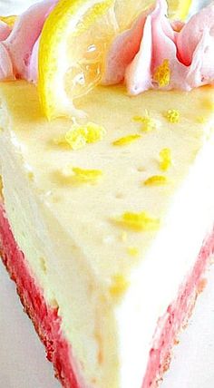 a piece of cake with lemon and pink icing on it sitting on a plate