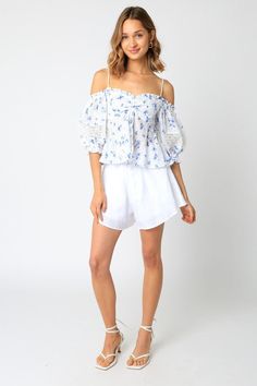 Final Sale-Get it before it's gone! Stroll along the Amalfi coast in the picture-perfect Positano White and Blue Floral Babydoll Top! The white and blue floral print fabric forms a cold shoulder neckline, ruched bust, and attached puff sleeve with crochet lace trim. Style with white shorts and sandals for a fun vacay look! DETAILS & CARE 100% Rayon. Machine wash cold. Imported. Floral Babydoll Top, Boho Pink, Blue Floral Top, Crochet Lace Trim, Floral Print Fabric, Pink Boho, Babydoll Top, Crochet Trim, Positano