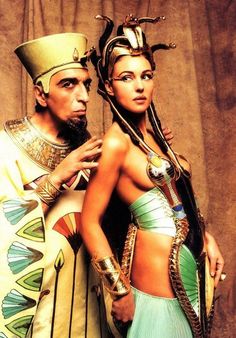 an egyptian man and woman dressed in costumes