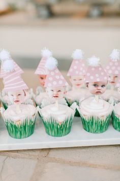 there are cupcakes with hats on them