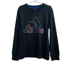 Adidas Long Sleeve T-Shirt Boys Size 5 In Black With A Colorful Logo, Nwt 100% Cotton Adidas Long Sleeve Cotton T-shirt, Sporty Multicolor Long Sleeve T-shirt, Adidas Multicolor Crew Neck T-shirt, Adidas Long Sleeve Sports T-shirt, Adidas Multicolor Graphic Print T-shirt, Adidas Casual Long Sleeve T-shirt, Casual Adidas Long Sleeve T-shirt, Casual Long Sleeve Adidas T-shirt, Adidas Long Sleeve Top With Logo Print