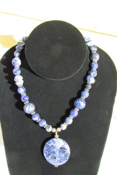 Beautiful Sodalite Necklace  I always finish off my chain on the necklace with 2 or 3 beads it gives it that little finishing touch.  This necklace is 23" long can be worn short or long with a sweater. I guaranty that the workmanship on all my jewelry I make is of top quality.  I do not ship International. Please feel free to email me with any questions you may have..                                             JEWELRY TIPS Any necklace that is Silver tone or Silverplate should not be worn in the shower or be worn when putting on perfume. The best way to clean your Sterling Silver or Silverplate is with a Silver Cleaning Cloth. Handmade Sodalite Round Bead Necklaces, Handmade Sodalite Round Beads Necklace, Sodalite Gemstone Beads Necklaces, Handmade Blue Sodalite Necklaces, Sodalite Necklace, Silver Cleaning, Jewelry Tips, Cleaning Cloth, Labour Day