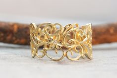 "An exceptional solid gold filigree ring with 3 diamonds. An Art Nouveau solid gold and diamonds ring.  This delicate ring entwined branches and leaves all around it 3 gold flowers are set among the flora - each one has a sparkly diamond in the center.  This lacy Ring is 13.5mm wide at the front and 7.5mm wide at the back for a comfortable fit, making this diamond ring perfect for everyday use as for any high-class event.  This Gold Filigree Ring would make a perfect engagement ring.  Make your Gold Filigree Ring With Diamond Accents For Promise, Elegant Gold Filigree Ring With Diamond Accents, Gold Filigree Ring With Diamond Accents, Gold Diamond Ring With Intricate Design, Gold Filigree Ring With Diamond Accents As Gift, Gold Diamond Filigree Ring For Wedding, Exquisite Gold Diamond Ring With Intricate Design, Yellow Gold Filigree Ring With Diamond Accents For Wedding, Elegant Gold Filigree Ring With Single Cut Diamonds