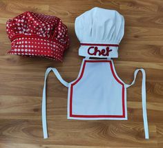 a chef hat and apron are on the floor