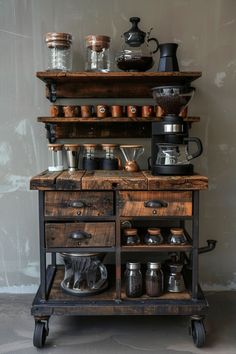 an old fashioned coffee maker with lots of pots and pans on it's shelf