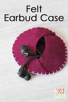 an earbud case made out of felt with the words, felt earbud case