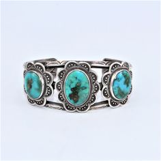 Sterling silver cuff with twisted rope design on band and with three large oval turquoise stones set into bezels with floral petal design and stamped details. Chainmail Bracelet, Engraved Flower, Wire Bangles, Vintage Traditional, Southwestern Jewelry, Turquoise Cuff, Square Bead, Rope Design, Jade Bracelet