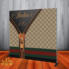 an open notebook with the word india on it sitting on top of a wooden floor