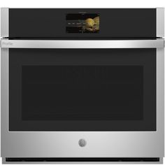 a stainless steel wall oven with the door open and an electronic display on it's side