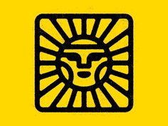 a black and yellow lion head in the center of a sunbursted square