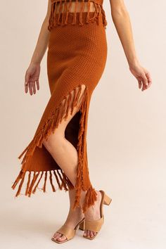 This Brown Tassle Detail Sweater Midi Skirt is crafted for comfort and style. Featuring tassle detailing, this midi skirt is the perfect addition to any outfit. The lightweight fabric offers a breathable fit, while the elastic waistband ensures a secure fit. Enjoy the sophisticated yet flattering look of this timeless piece. Fabric & fit: 100% Cotton Model is wearing size Small.