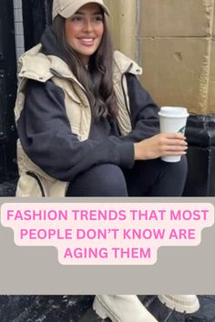 a woman sitting on the ground holding a coffee cup with text overlay reading fashion trend that most people don't know are aging them