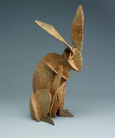 a sculpture of a rabbit sitting on its hind legs