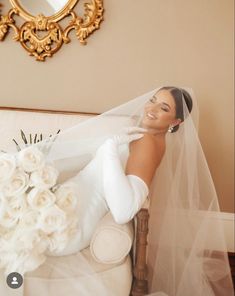 the bride is laying down on her wedding day