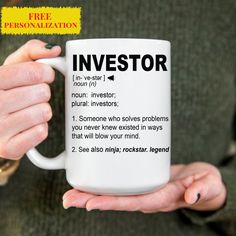 a person holding a coffee mug with the words investor on it