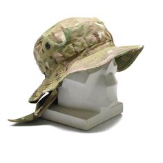 This hat used by British troops in various situations. The hat is designed specifically for the hot year season. The simple but incomparable design of the hat makes you feel comfortable in the hottest days and protects you from direct sunlight and overheating. The vent holes around the head allow moisture to evaporate and minimize head sweating. A high quality, climate-adjusted neck flap provides extra protection against burns and discomfort in your neck area. The hat has been made of multi-terr Adjustable Military Style Khaki Sun Hat, Military Style Khaki Bucket Sun Hat, Military Style Khaki Bucket Hat, Military Style Khaki Brimmed Bucket Hat, Military Style Khaki Bucket Hat With Brim, Durable Military Hats For Outdoor, Curved Brim Military Hat For Hunting, Military Hunting Hat With Curved Brim, Outdoor Military Style Bucket Sun Hat