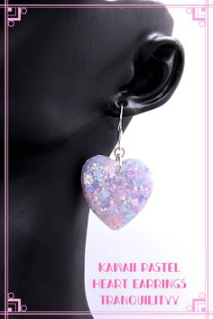 💖Welcome to Tranquilityy  I have for you an awesome pair of pastel Mix glitter blend resin heart earrings ice glitter, and much more in person how it catches the light. I use my glitter blend I also have mermaid ICE mylar blue /pink glitter flakes. Your earrings are made with resin and your glitter that gives its brilliant sparkle measures 1" across, on 925 sterling silver hooks. Your earrings will come in a gift box, take care and God bless.✨   ✨I can make these gorgeous hearts into chokers, necklaces, zipper pulls and much more, convo me for a custom listing, my hearts are more beautiful in person and would make a perfect gift.✨ Earrings Kawaii, Glitter Flake, Glitter Earrings, Purple Earrings, Pink Glitter, Heart Earrings, God Bless, Jewelry Earrings Dangle, 925 Silver