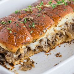 a close up of a plate of food with meat and cheese on it's side