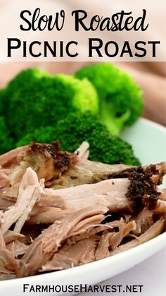 slow roasted pork roast served with broccoli and carrots on a white plate