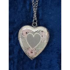 Vintage Sterling Silver 18" chain & about 1" heart locket. Front of heart has decorative etching with slight pink and yellow tones. Silver is tarnished on heart and chain. Comes in original box which shows some wear. Appears to not have been worn. Vintage Nickel-free Double Heart Jewelry, Vintage Metal Locket Necklace For Valentine's Day, Vintage Pink Necklaces For Valentine's Day, Vintage Pink Necklace For Valentine's Day, Vintage Personalized Open Heart Necklace, Personalized Vintage Open Heart Necklace, Vintage Nickel-free Heart Pendant Necklace, Vintage Double Heart Metal Necklace, Vintage Metal Heart Locket Necklace