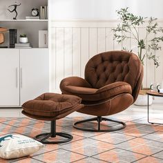 a brown chair and ottoman in a room with a rug on the floor next to it