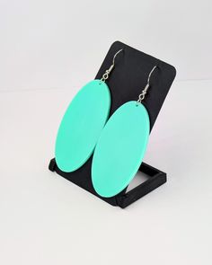 Show the world that you have taste with these minimalistic turquoise drop earrings inspired by the fictional character Momo Ayase from the popular "Dandadan" series. D E T A I L S --Turquiose  polymer blend derived from sugarcane and other natural resources --Professionally CAD modeled, prototyped and tested in-house from start to finish --Hand finished and assembled in-house --3D Printed with mixed materials at an ultra-fine 0.1mm layer height --Designed light weight for minimal ear fatigue --E Dog Throwing Up, Momo Ayase, Jagged Edge, Turquoise Drop Earrings, Oval Earring, Designer Earrings, Teal Blue, Mint Green, San Jose