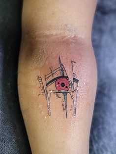 a tattoo on the leg of a person with an eyeball in it's center