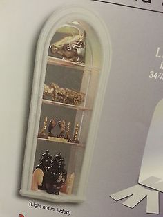 a display case with many different types of figurines on it's shelves