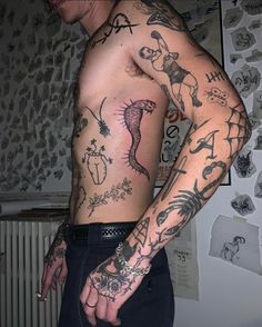 a man with many tattoos on his body