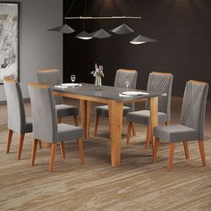 a dining room table with grey chairs around it