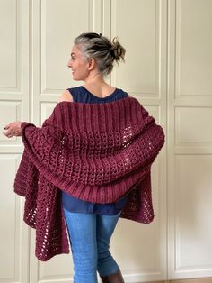 a woman wearing a red knitted shawl