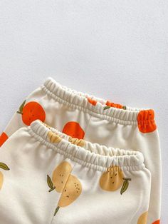 Made from Organic Cotton: An eco-friendly, breathable, and hypoallergenic fabric that’s gentle on delicate skin. Care Instructions: Machine wash on a gentle cycle, tumble dry on low. A Thoughtful Gift: Ideal for birthdays, holidays, or any day you want to make extra special for the little one in your life. Accessories not included. Fruit Graphic, Baby Fruit, Fruit Orange, Baby Jogger, Printed Joggers, Fruit Print, Boys Set, Jogger Set, Pants Casual