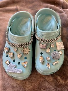 (JUST REDUCED BY $50.00) Baby blue Crocs, size 9W customized with Saweetie x Crocs Jibbitz charms (all 5 included!) plus additional diamond charms and diamond metal chains to add sparkle.  Enclosed in the original Crocs bag and never worn.  Brand new and ready to wear.  Only 1 custom pair Very limited and one of a kind customization. Special orders on request per availability of Crocs and charms) Crocs With Chain, Cute Crocs Shoes Charms, Blue Crocs With Charms, Crocs Inspo Charms, Blue Crocs With Jibbitz, Crocs Decor Ideas, White Crocs With Charms, Crocs Charms Aesthetic, Croc Colors