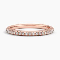 a rose gold wedding band with diamonds